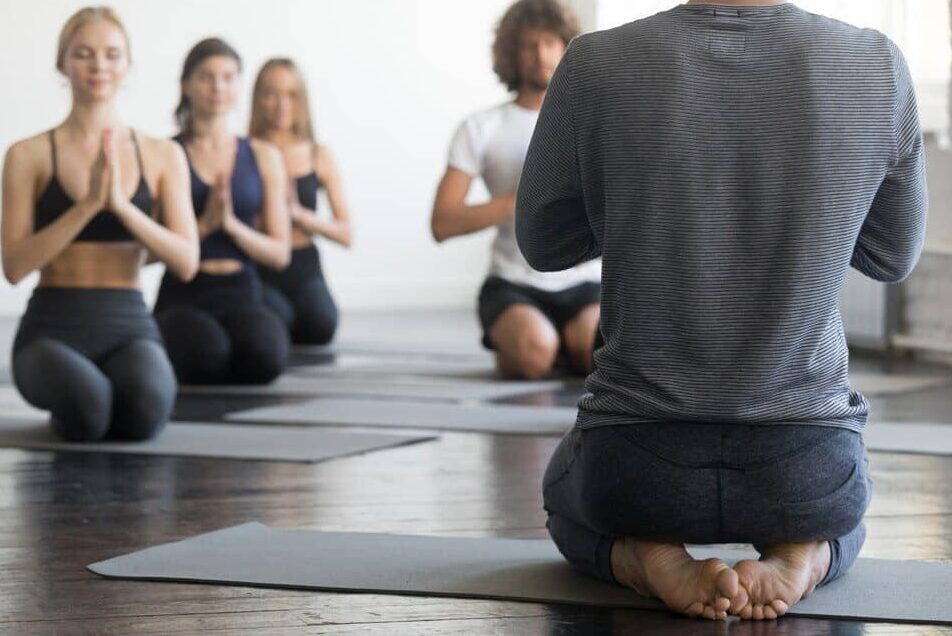 Person teaches how to do Vajrasana